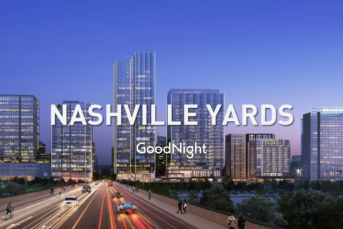 A vibrant exterior view of Midtown at dusk, showcasing tall modern buildings, the city skyline lit up, and lively lighted streets. The scene captures the buzz of evening strolls, dining out, and the energetic nightlife that defines the area.